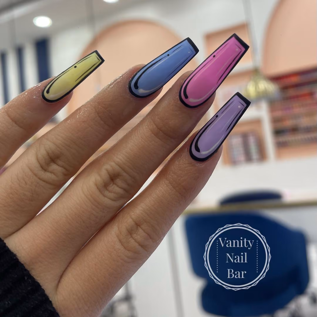 Long coffin nails in pastel green, blue, pink and lilac with black outline nail art